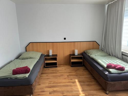 Cama ou camas em um quarto em Domum 5 Moderne Ferien- Monteurapartments inkl Wlan und Waschmaschine in Mülheim an der Ruhr