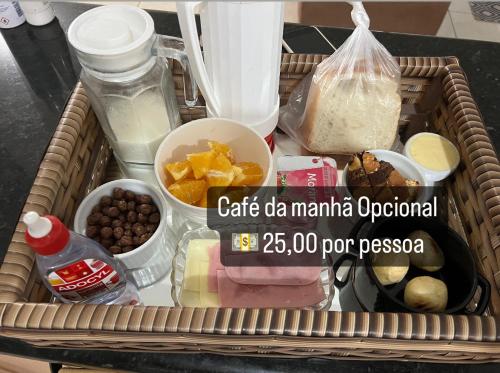 a basket filled with food in a refrigerator at Container Suítes Recanto Monte Trigo in São Francisco do Sul