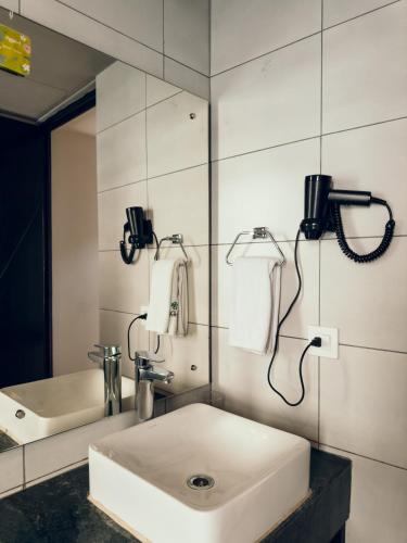 a bathroom with a sink and a mirror at Jade City Hotel in Pokhara