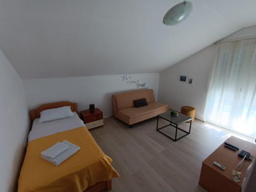 Postel nebo postele na pokoji v ubytování Apartments Toni