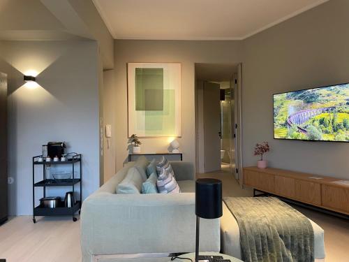 a living room with a couch and a tv at BestHomeStay-Lisbon (Campolide) in Lisbon