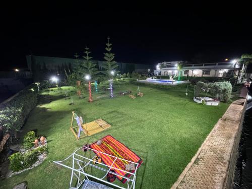 an aerial view of a park at night at Gîte Jnane fès in El Jadida