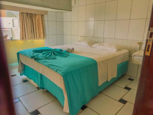 En eller flere senge i et værelse på Hotel Arrecife dos Corais
