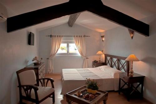 Ένα ή περισσότερα κρεβάτια σε δωμάτιο στο L'Isula Rossa