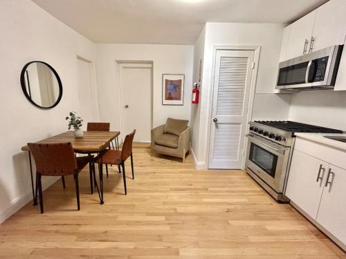 a kitchen and dining room with a table and chairs at 232- 2B 2B Central Hoboken in Hoboken