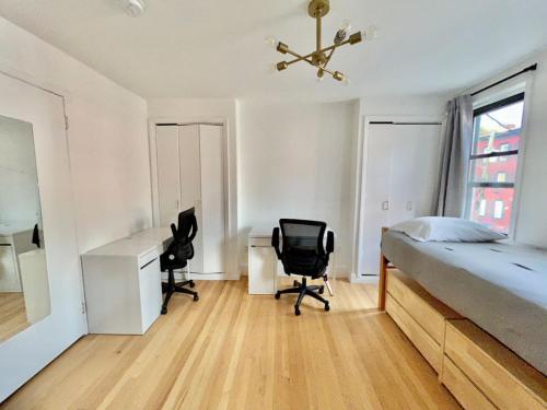 a bedroom with a bed and a desk and a chair at 232- 2B 2B Central Hoboken in Hoboken