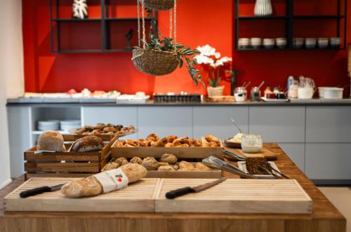 a table with many different types of breads and pastries at Good Morning City Copenhagen Star in Copenhagen