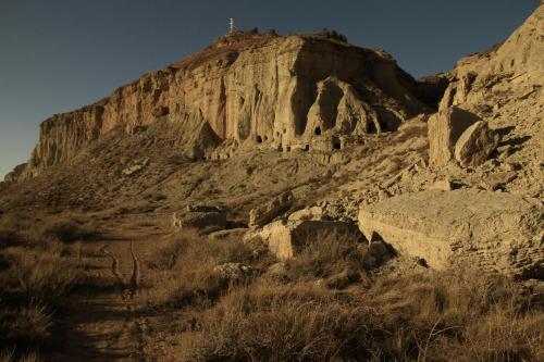 a mountain with a cross on top of it at Casa Rural "La Bardena Blanca I " in Arguedas