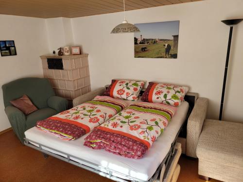 Кровать или кровати в номере Ferienhaus Anni