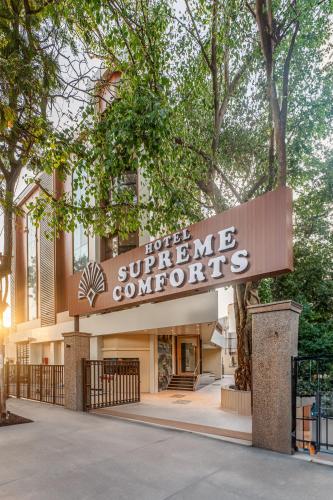 a building with a sign that reads hotel supremeounters at Hotel Supreme Comforts - Mumbai Airport in Mumbai