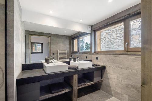 two sinks in a bathroom with two windows at Chalet nid des écureuils in Font-Romeu-Odeillo-Via