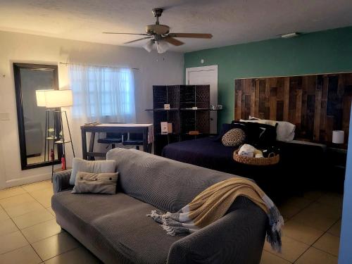 a living room with a couch and a bed at Life is good in St Petersburg