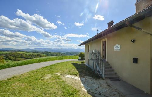 a building with a staircase next to a road at Gorgeous Home In Murazzano With Wifi in Murazzano
