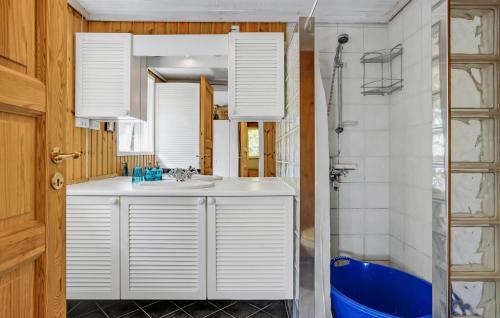 a bathroom with a white sink and a mirror at 3 Bedroom Stunning Home In Ebeltoft in Ebeltoft
