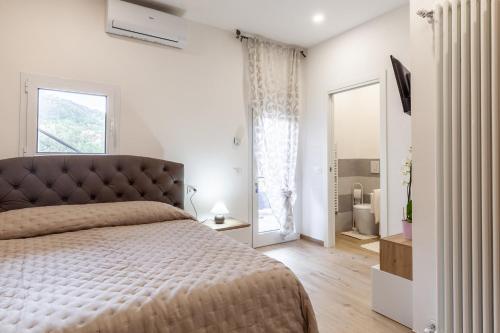 מיטה או מיטות בחדר ב-Casa Eros