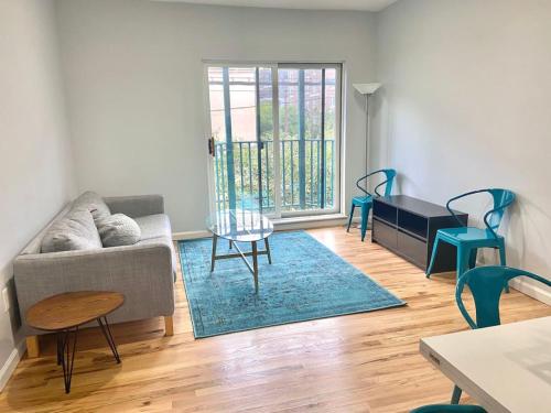 a living room with a couch and a table at 204-Bright 2Bed 2Ba w Stainless Steel Appliances in Hoboken