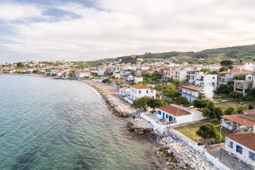 an aerial view of a town next to the water at Evi's Seafront Hideaway - Petalidi Cozy Nest in Petalidhion