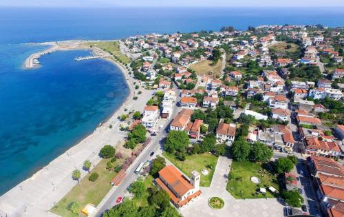 an aerial view of a town next to the ocean at Evi's Seafront Hideaway - Petalidi Cozy Nest in Petalidhion