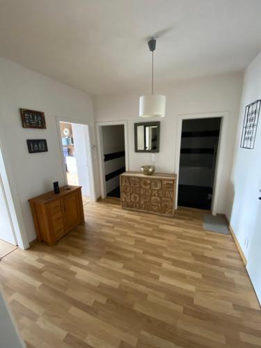 an empty living room with a wooden floor at Apartment in the Heart of Ostrava in Moravská Ostrava