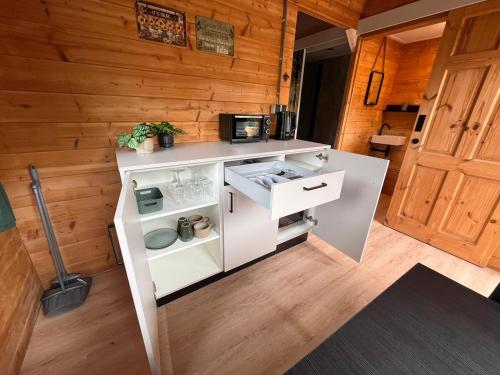 an overhead view of a kitchen in a tiny house at Herberg de Bos in Swalmen