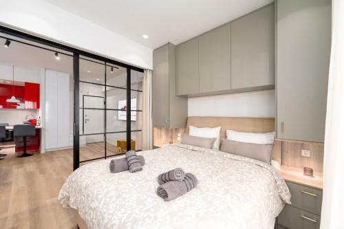 Ένα ή περισσότερα κρεβάτια σε δωμάτιο στο Alkis Luxury By Greece Apartments