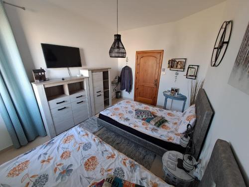 Postel nebo postele na pokoji v ubytování Sunshine Court Budget