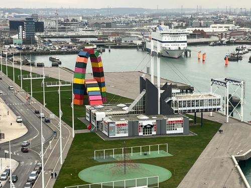 a view of a city with a river and a building at Lovely plage - St François - Mer in Le Havre