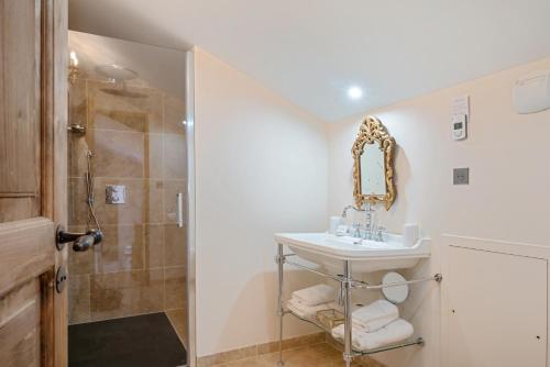 a bathroom with a sink and a shower at Château de Saint Vidal in Le Puy en Velay