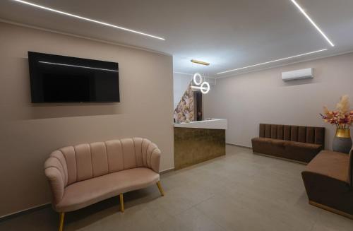 Μια τηλεόραση ή/και κέντρο ψυχαγωγίας στο B&B Suites&Rooms piazza dei martiri