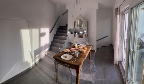 a kitchen with a table with food on it at Einzigartiges Haus mit wunderbaren Seeblick auf Lago Maggiore in Massino Visconti
