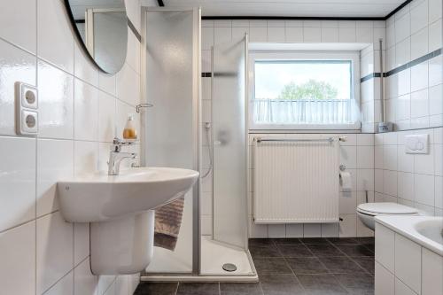 Ένα μπάνιο στο Ferienwohnung in Spelle