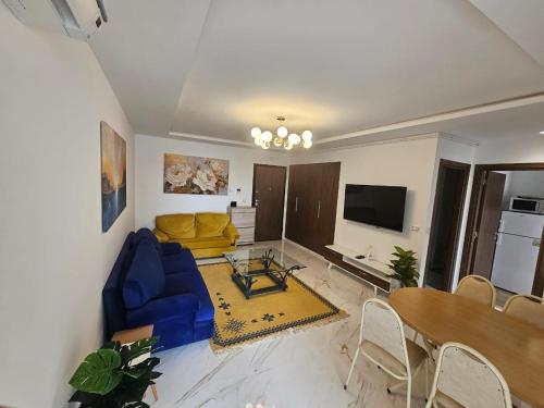TV a/nebo společenská místnost v ubytování cosy appartement cité wehat