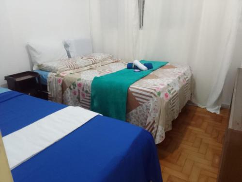 מיטה או מיטות בחדר ב-Apart House SALVADOR PRAIA