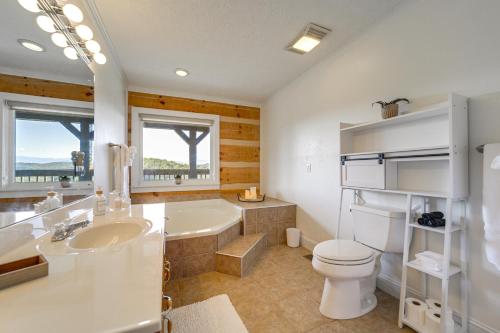 a bathroom with a tub and a toilet and a sink at Panoramic Mtn Views Spacious Tennessee Home! in Newport