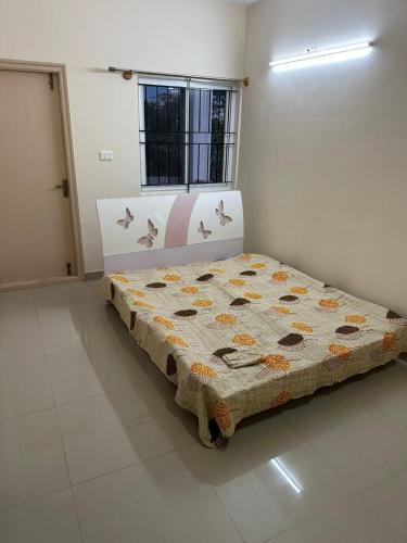 a bedroom with a bed in a room at Aashish villa in Devanahalli-Bangalore