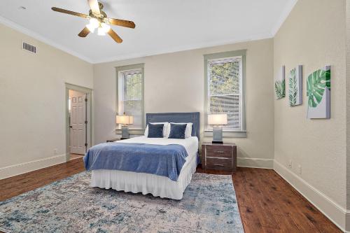a bedroom with a bed and a ceiling fan at The Ray- 1st Floor Charming Condo- Walk to Downtown in St. Augustine