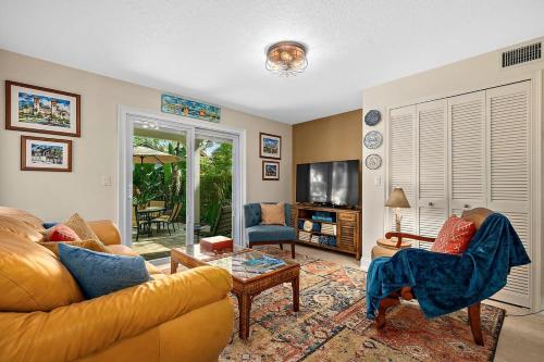 a living room with a couch and a table at Casa DeSoto - Luxury Downtown Oasis in St. Augustine