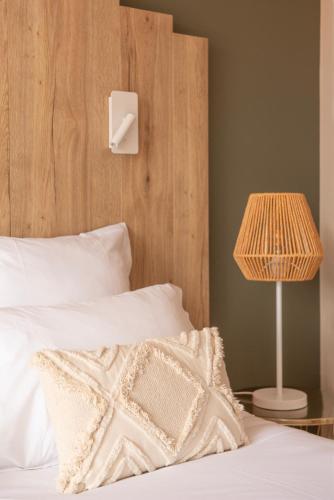 Postel nebo postele na pokoji v ubytování Hôtel BO & MIA