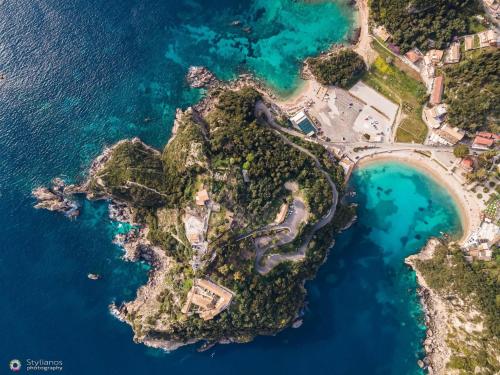 an aerial view of a small island in the ocean at Rena Studios in Paleokastritsa