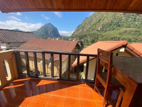 a balcony with a view of a mountain at Cam U View Bungalow in Nongkhiaw
