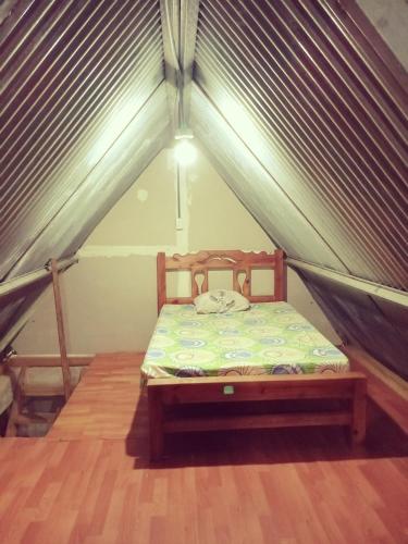 a bedroom with a bed in a tent at Cabaña sinfonía natural in El Quije