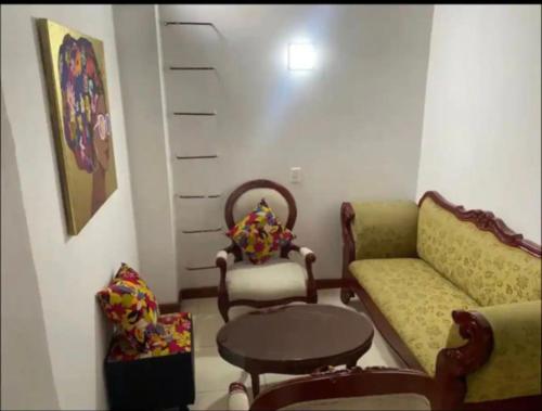 a living room with a couch and a table and chairs at Apartamento 502 in Itagüí
