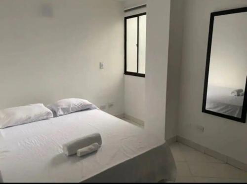 Säng eller sängar i ett rum på Apartamento 502