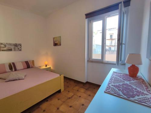 Llit o llits en una habitació de Le Case Bianche di Castelsardo