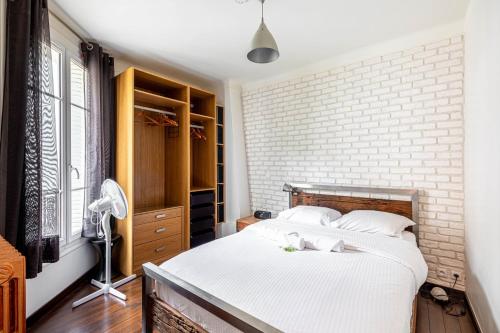 Katil atau katil-katil dalam bilik di GuestReady - Neat Hideaway near Paris