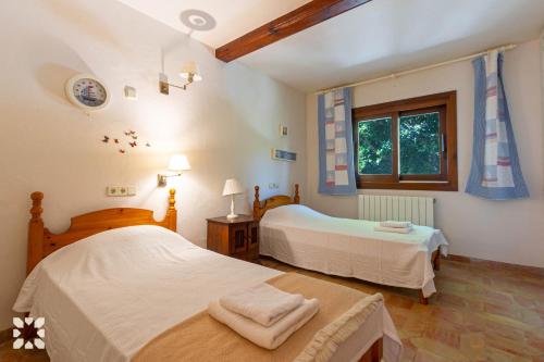 Posteľ alebo postele v izbe v ubytovaní Villa Alessia by Abahana Villas