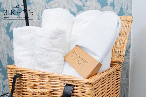 a basket of towels with a box in it at Contractors 20% Monthly Discounts! WIFI & Parking! in Sheldon