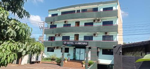 a building with a sign that reads coffee limits at Hotel LLamosas in Ciudad del Este