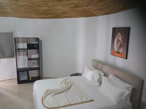 Ein Bett oder Betten in einem Zimmer der Unterkunft Sen hôtel