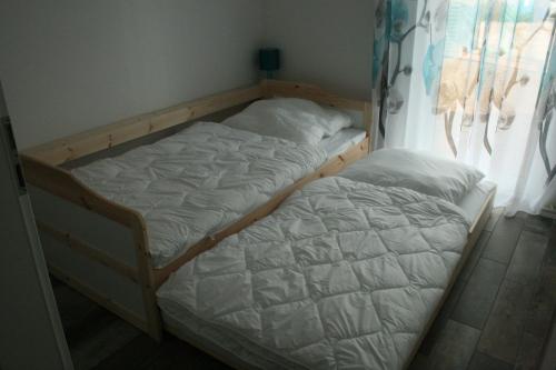 Postel nebo postele na pokoji v ubytování Ferienwohnung Zinnowitz